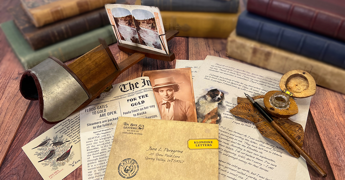 Tin Box Letters correspondence with vintage books, a stereoscope, and writing accessories